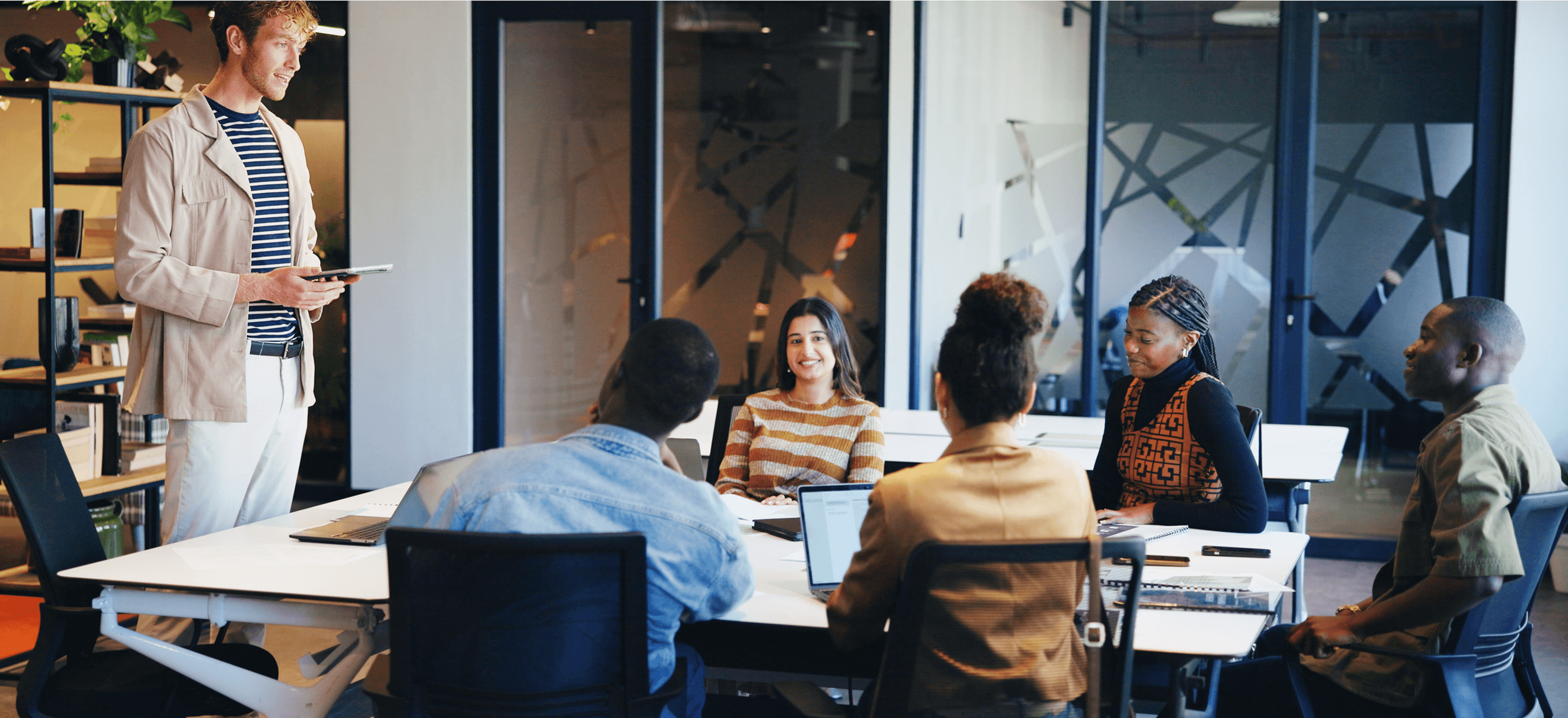 A professional meeting in progress with diverse team members